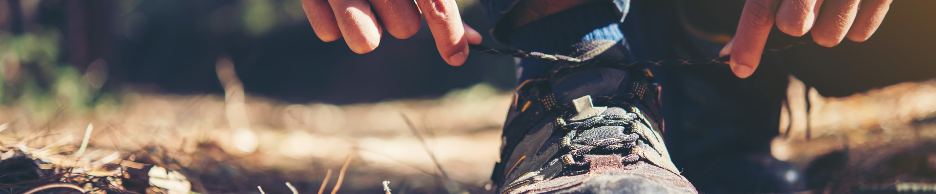 young-hiker-man-ties-laces-his-shoe-holiday-backpacking-forest.jpeg